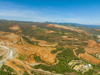 Aerial view of Nickel Mining in the mountain. Forest shade of red color. Mindanao, Philippines.