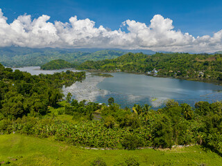 Lake Sebu, South Cotabato, Philippines. Tropical Landscape with blue sky and clouds. Aerial drone view in Mindanao.