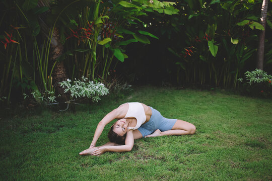 Relaxed woman stretching during yoga session
