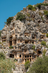 The ruins of the amphitheater and ancient rock tombs in the ancient city of Myra in Demre, Turkey