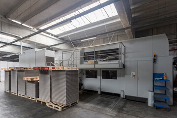 A machine for the industrial processing of paper and cardboard, there are no visible people