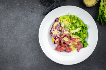 chicken stomach salad green lettuce, onion, salad dressing vegetable food healthy meal food snack on the table copy space food background rustic top view keto or paleo diet
