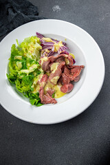 chicken stomach salad green lettuce, onion, salad dressing vegetable food healthy meal food snack on the table copy space food background rustic top view keto or paleo diet