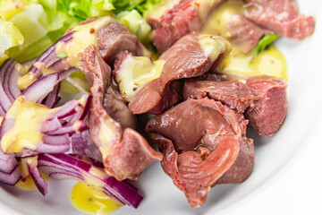 chicken stomach salad green lettuce, onion, salad dressing vegetable food healthy meal food snack on the table copy space food background rustic top view keto or paleo diet