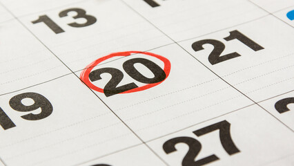 A close-up calendar sheet highlighting the 20th