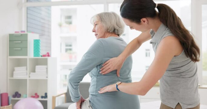 Woman, physiotherapist and back rehabilitation of senior patient, medical advice and physical therapy service. Physiotherapy, healthcare assessment and chiropractor healing muscle injury of arthritis
