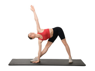 Fototapeta premium Yoga workout. Young woman stretching on white background