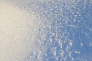 textured snow background in sunny frosty day