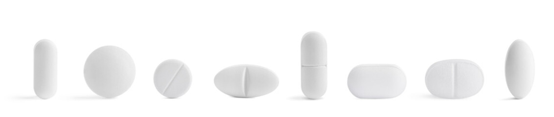 Set of different pills in row isolated on white