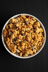 Protein Granola with hazelnut, almond, and chocolate in a Bowl, top view.