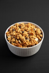 Protein Granola with hazelnut, almond, and chocolate in a Bowl, side view.