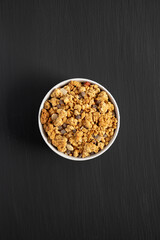 Protein Granola with hazelnut, almond, and chocolate in a Bowl, top view.
