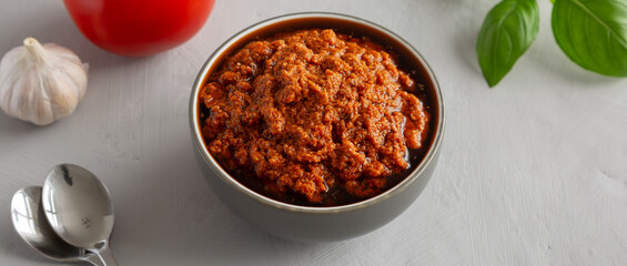 Homemade Sun Dried Tomato Pesto in a Bowl, side view.