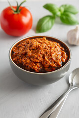 Homemade Sun Dried Tomato Pesto in a Bowl, side view.