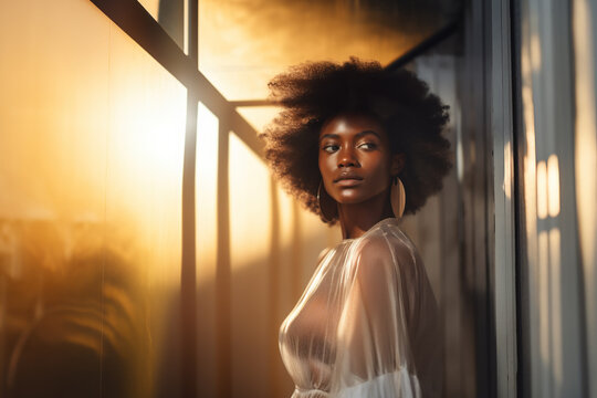 Ebony model in ethnic earrings.	