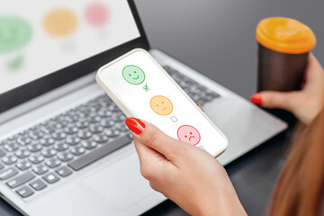 girl working with laptop and mobile phone sitting at a table in a cafe