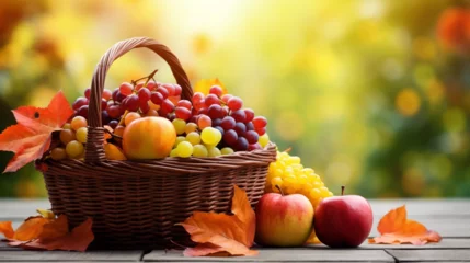 Poster beautiful autumn still life of a basket of fruits, grapes, leaves  © Amir