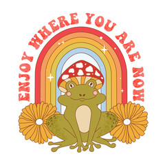 Retro 70s groovy funky frog with mushroom, flowers and rainbow. Enjoy where you are now slogan print with frog character wearing mushroom hat. Naive groovy psychedelic vintage illustration.