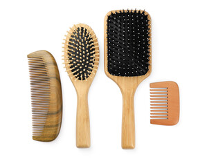 Set of hair brushes and combs isolated on white, top view