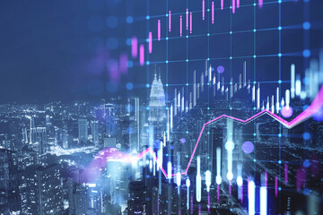 Glowing candlestick forex chart on blurry city buildings texture. Technology, trade and financial...