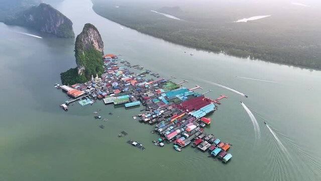 Aerial view of Koh Panyee is a fishing village in Phang Nga province, Thailand. There is a floating soccer field. This island is the main attraction of the Phang Nga Bay tour. Popular food stops