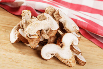 Delicious Sliced Shiitake Mushrooms isolated on a wooden background