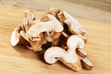 Delicious Sliced Shiitake Mushrooms isolated on a wooden background