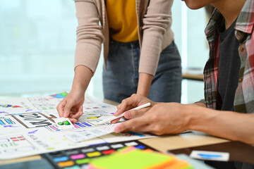 Group of application developers working on new website wireframe, planning application development at creative office