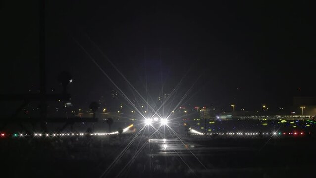 Commercial airplane landing at airport terminal runway after flight