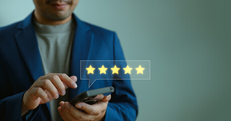 Customer review good feedback, close up Man hand using smartphone with popup five-star icon for...