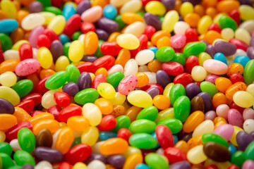 Fototapeta na wymiar Delicious jelly beans of different colors, close up.