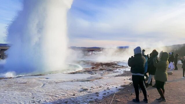 Iceland. Erupting geyser Strokkur. Strokkur is part of geothermal area. Smoke over the ground. The most beautiful places on the Earth.