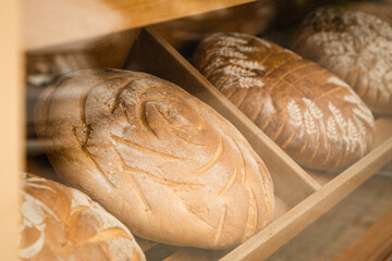 Window of bakery with fresh breads view from the street.