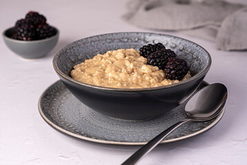 Food photography of oatmeal, porridge, blackberry, fibre, ripe, vegan, wholegrain, lifestyle, dish, berry, homemade