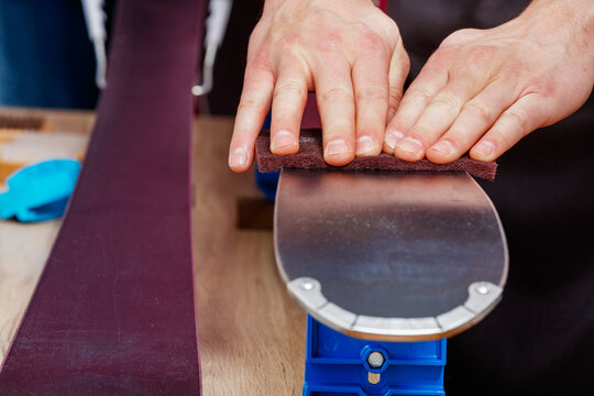 Closeup Of Ski Cleaning Process In Workshop