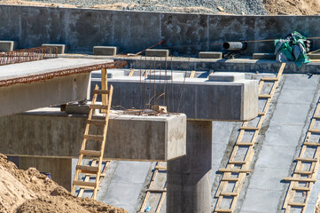 Construction of a road bridge. Concrete bridge supports
