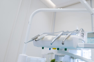 Set of professional equipment in dentist's office. Interior of a dental clinic. Dental office without people. Dentist's instruments, equipment and tools. 