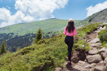 Fit Woman in the beautiful green summer mountain . Vitosha mountain ,Bulgaria