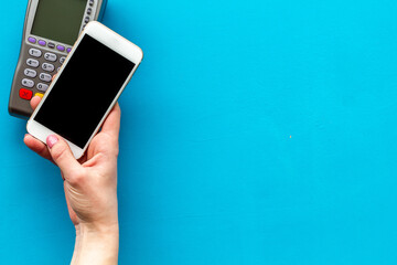 POS payment terminal reader with mobile phone. Online banking concept