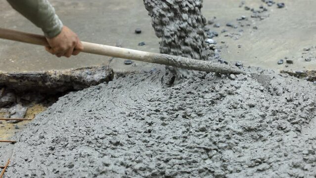 Pouring cement during for construction from concrete mixer truck car.
