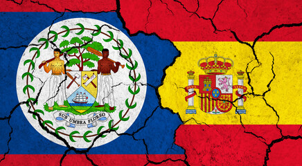 Flags of Belize and Spain on cracked surface - politics, relationship concept