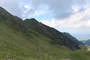 Fototapeta premium A green mountain with a path