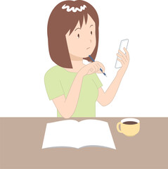 ノートとスマホを見る女性