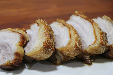 Oriental Roast Pork Belly on wooden chopping board