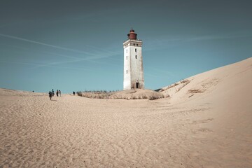 Picturesque lighthouse located in the sand dunes of Northern Denmark