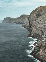 Fototapeta na wymiar Stunning image captures the majestic cliffs of Faroe Islands