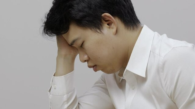 Man with narcolepsy is fall asleep on office desk..Narcolepsy is a sleep disorder that makes people very drowsy during the day.