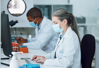 Woman, computer and face mask in science laboratory for medical virus research, medicine or vaccine...