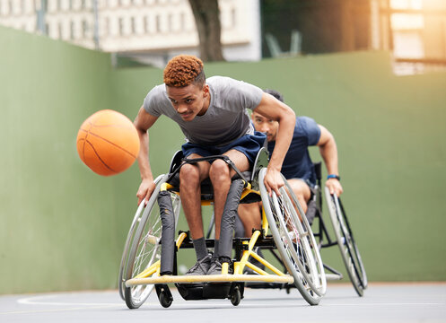 Sports, basketball game and men in wheelchair in action for training, exercise and workout on outdoor court. Fitness, team and male people with disability and ball for match, practice and games