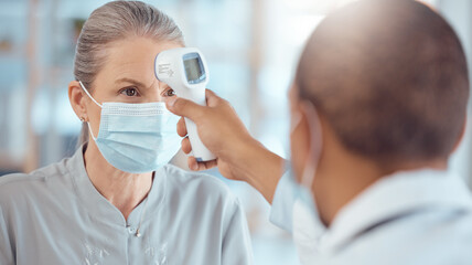 Woman in face mask, doctor and thermometer in office for covid test, safety and healthcare in hospital consultation. Temperature check, corona and patient at clinic with medical professional for exam